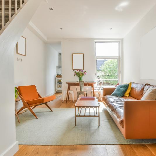 Orange chairs in open plan living area